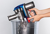 The Dyson DC35 モーターヘッド cordless vacuum cleaner. Hygienic bin emptying. Just push the button to release the dirt.